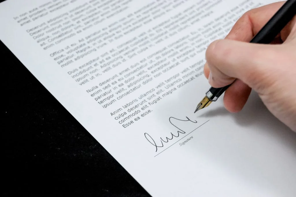 Lease termination_Person signs lease